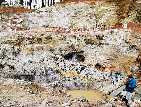 Figure 7. Open pockets along the core zone of the Havey pegmatite near Poland, Androscoggin County, Maine, in June 2017. Courtesy of William (Skip) Simmons.