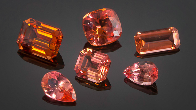 Nigerian väyrynenite vary from orange to orangy pink colors and occur in high clarity. These stones range from 0.72 to 2.45 ct. Photo by Nuttapol Kitdee; courtesy of Thai Lanka Trading.