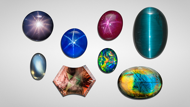 Figure 1. A variety of some of the most common phenomenal gemstones. Top row, left to right: 2.35 ct 12-rayed star sapphire from Sri Lanka, gift of Gordon Bleck, GIA Museum no. 17037; 18.18 ct blue star sapphire, courtesy of Evan Caplan; 18.29 ct star ruby from Myanmar, courtesy of the Natural History Museum of Los Angeles County; 36.76 ct cat’s-eye tourmaline from Brazil, courtesy of Pala International. Bottom row, left to right: 7.60 ct moonstone from Sri Lanka; 11.0 ct Oregon sunstone displaying aventurescence over red and green bodycolors; 11.45 ct black opal from Australia displaying vibrant play-of-color; 30.82 ct Finnish labradorite cabochon from GIA’s Dr. Edward J. Gübelin collection. Photos by Robert Weldon (six stones on the left) and Orasa Weldon (two stones on the right).
