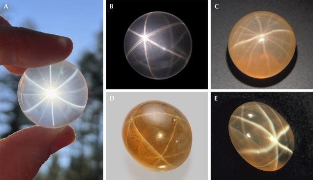 Figure 16. A: A 178 ct 12-rayed star rose quartz sphere in transmitted light; courtesy of Far Arden Essentials. B: An 8.51 ct double polished rose quartz cabochon showing double stars due to reflection from the back surface; courtesy of GIA Museum, collection no. 35214. C: A 31.37 ct star quartz from Sri Lanka shows a complex network of stars with a 12-rayed star in the center; courtesy of Michael Schramm. D: A 44.25 ct star smoky quartz with a network of stars; courtesy of GIA Museum, collection no. 31575. E: A 22 ct multi-star quartz with a strong 6-rayed star in the center. Photos by Lylith Aradia Moon (A), Emily Lane (B and D), Maha Tannous (C), and Andrew Quinlan (E).