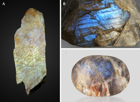 Figure 29. A: A peristerite from Ontario, Canada (7 cm long), showing pink, yellow, and green iridescence; courtesy of GIA Museum, collection no. 32588. B: Clear peristerite from Tanzania (677 g) showing light blue iridescence on the (010) cleavage surface; gift of Lithos Africa. C: A polished peristerite from Tanzania (7.5 cm long) that also displays aventurescence from hematite platelet inclusions; courtesy of Rachelle Turnier. Photos by John Montgomery (A) and Emily Lane (B and C).