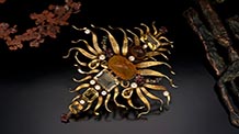 “Solar Motive” brooch made of Baltic amber, citrine, garnet, cultured pearl, seed pearl, 18K gold