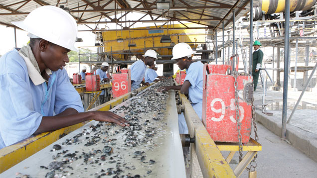 Workers at Gemfields washing plant. 