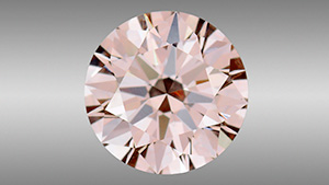 Natural Fancy pink diamond with apparent HPHT synthetic growth structure.