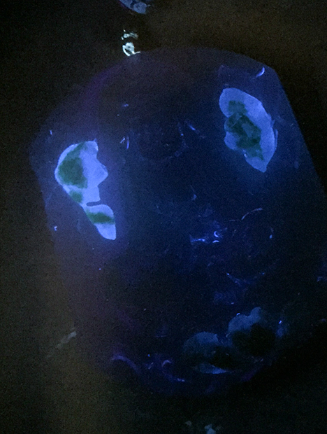 Blue-white fluorescence of resin.