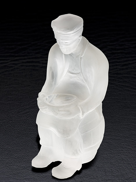 Paul Dreher figure of a gem carver holding a bowl