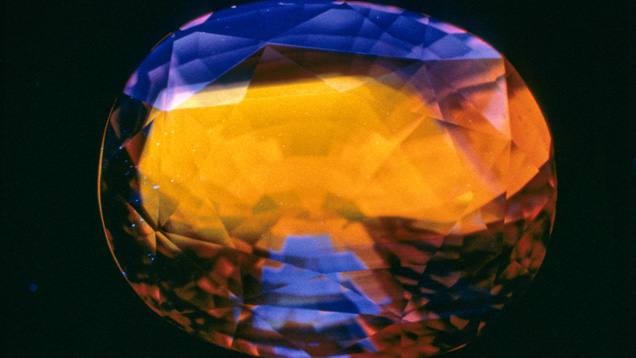 Orange fluorescence in blue sapphire