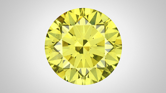 Face-up view of a green-yellow round brilliant diamond.