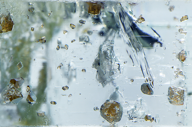 Raman identified these inclusions as spessartine.