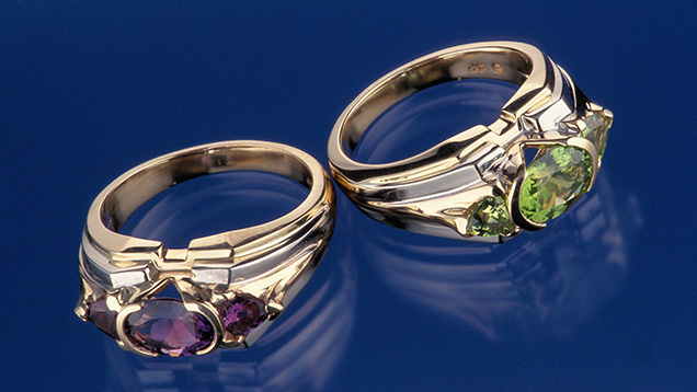 “Healing Sisters” rings featuring amethyst and peridot.