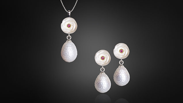 Figure 20. White freshwater pearl “carnations” accented with rubies and set in 14K white gold with teardrop-shaped Momento pearls, each holding a tiny NFC chip ready to store a variety of digital assets and precious memories. Courtesy of Chi Huynh.