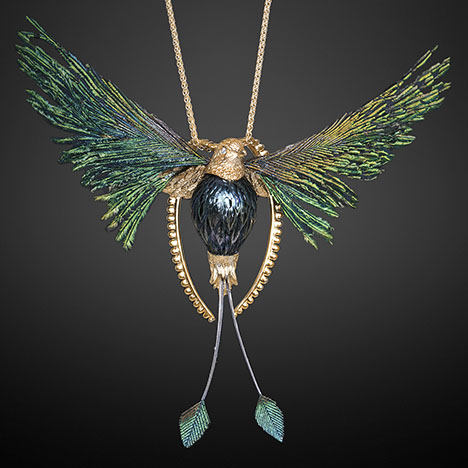 Figure 8. The “Lightness of Being” pendant symbolizes freedom and was inspired by Huynh’s favorite bird. The main 15 × 11 mm Tahitian pearl body was hand-carved to imitate the body of a peacock, and the pearl’s color matches its feathers. Courtesy of Chi Huynh.