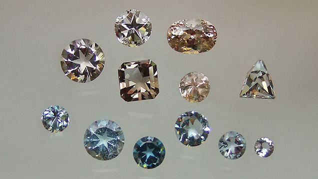 Figure 3. Faceted Texas topaz specimens with brown, blue, and green bodycolors, ranging from 0.62 to 9.34 ct. Texas topaz has been sought after for its naturally occurring blue color. Photo by Brad Hodges; courtesy of Diane Eames.