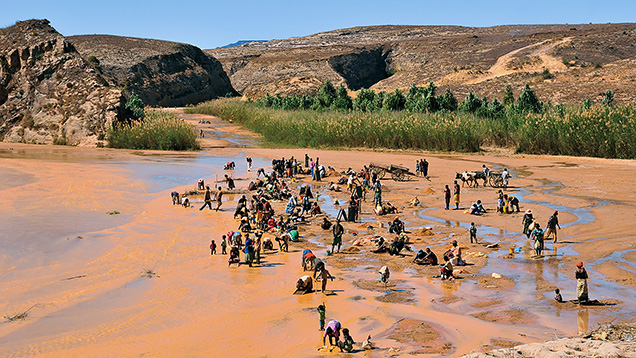 Figure 8. Local people washing for sapphires in 2010 near the village of Ambalavy 50 km southwest of Ilakaka in south-central Madagascar. Photo by Vincent Pardieu.