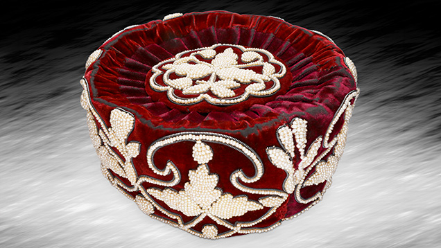 Figure 1. This antique Indian-style headdress is decorated with handwoven light cream and cream-colored seed pearls. Photo by Gaurav Bera.