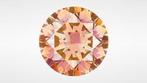Figure 1. This 2.20 ct Fancy Deep brownish orange treated HPHT-grown diamond owes its distinctive appearance to multiple defect concentrations created within the various growth sectors. Photo by Diego Sanchez.