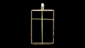 Figure 1. A rock crystal pendant measuring 48.5 × 31.2 × 8.8 mm with a white cross inclusion. Photo by Tsung-Ying Yang.