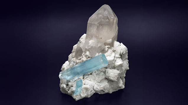 This 9.885 kg specimen of aquamarine on albite with a quartz cathedral center, measuring 31 × 23 × 28 cm, is from Pakistan’s Shigar Valley. Courtesy of GIA Museum, collection no. 43068. Photo by Robert Weldon.