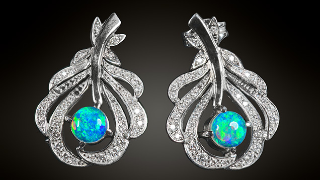 Figure 19. White gold earrings containing Slovak Opal (0.72 ct total) and diamonds. Photo by Albert Russ; courtesy of Great Rent JSC.