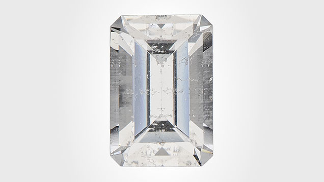 Figure 1. This 0.59 ct near-colorless octagonal step-cut armenite measuring 6.01 × 4.07 × 3.33 mm marks the first time this mineral has been submitted to a GIA laboratory. Photo by Diego Sanchez.