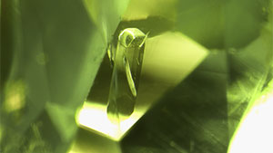 A euhedral tourmaline crystal in a tourmaline host. Photomicrograph by Hikaru Sato; field of view 1.95 mm.