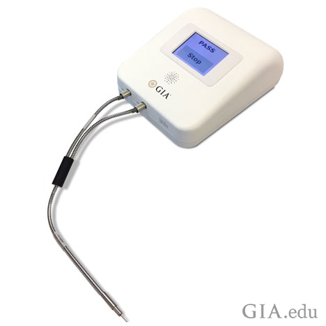 The GIA iD100 gem screening device, prototype shown above, was introduced earlier this year. GIA staff in Hong Kong used the device to screen for synthetics in a diamond ring set with melee and  a marquise-cut diamond center stone. Photo by GIA
