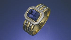 This lovely iolite is set into an attractive yellow and white gold ring. – Tino Hammid
