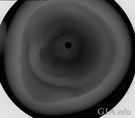 Figure 7: Microradiograph taken in the third direction (down the drill‐hole). The drill‐hole is the small black circle towards the center.